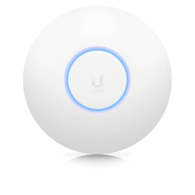 Ubiquiti UniFi 6 Lite small round white access point on a ceiling
